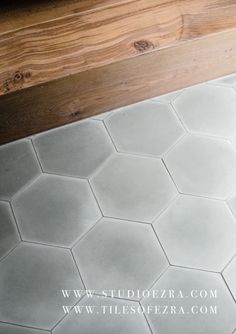 the floor is made up of hexagonal tiles, and has wood in it