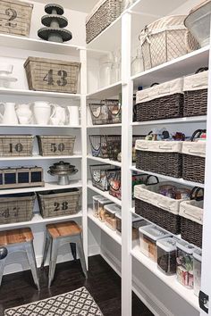 an organized pantry with baskets and other items