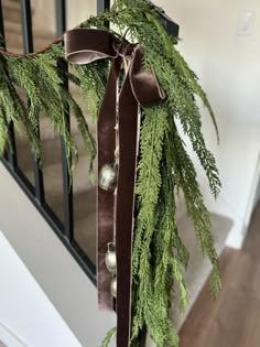 This brown velvet bow is perfect for adding a hint of warmth and luxury to any corner of your home this holiday season. This bow looks beautiful clipped to a garland on a banister, fireplace, or wreath. Please note, this listing is for the bow and/or bells ONLY and does not include the wreath. My wreath is 20" wide for size reference and is for display only. This ribbon comes in two different lengths, and can come with or without a set of coordinating bells. Each bow comes securely attached to a Velvet Ribbon On Garland, Garland With Ribbon Christmas, Big Bow Wreath, Velvet Ribbon Garland, Velvet Bow Wreath, Velvet Ribbon Wreath, Garland Banister, Velvet Christmas Decor, Dusty Blue Theme