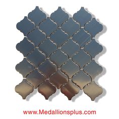 a metal mosaic tile with an intricate design