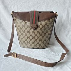 Vintage Gucci Sling Bag In Very Good Shape. No Rip Or Tear. Leather Material Still Intact. Gold Hardware Has Tarnished A Little Bit Due To Age. Rubs And Minor Discoloration Of Leather Are Noticeable When Closer Look. Overlapping Leather With Sherry Line Strap And Magnetic Lock For Secure Top Closure. Inside Bag Is Canvas With Visible Marks Of Usage And Minor Stain But Can Be Wash By Hand. No Dustbag. No Inclusion. Dimension: H 9in L 10.5- 7.5in W 4.5in Sling Drop 20in Gucci Sling Bag, Gucci Marmont Super Mini, Gucci Sling, Gucci Marmont Mini, Gucci Marmont Bag, Embroidered Shoulder Bag, Gucci Crossbody Bag, Gucci Purse, Gucci Tote Bag