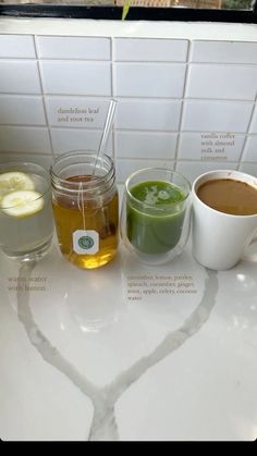 three different types of drinks on a counter