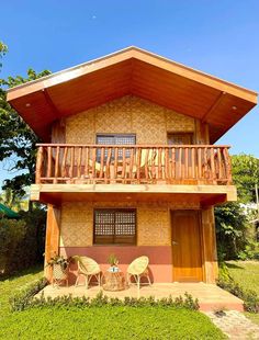 a small house with wooden balconies and balcony