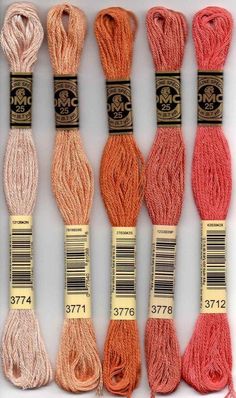 six skeins of yarn in different colors