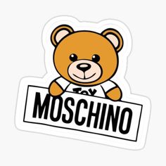 a brown teddy bear holding a sign that says moschino