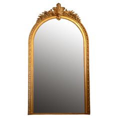 an ornate gold framed mirror against a white background