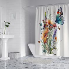 a bathroom with a shower curtain decorated with flowers and butterflies