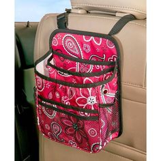 the back seat pocket is holding a purse in it's car holder, which also has an additional compartment for storing items