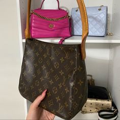 This Beauty Is An Authentic 2003 Lv Looping Bag. It Is In Excellent Condition And Only Shows A Few Marks Of Wear And Tear. On One Side Of The Handle A String Came Loose So I Rethreaded It And Tied It. It Has Stayed Put Ever Since! The Leather Has Aged Perfectly And The Inside Only Had One Mark At The Bottom! Louis Vuitton Croisette, Louis Vuitton Neverfull Damier, Lv Pochette Metis, Uggs With Bows, Louis Vuitton Tivoli, Louis Vuitton Totally, Louis Vuitton Petit Noe, Marc Jacobs Purse, Lv Pochette