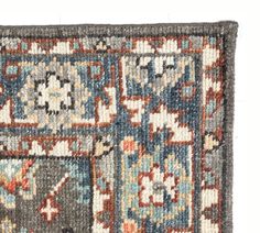 an old rug with many different colors and designs on it's sides, including the middle