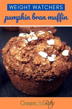 some muffins are sitting on a table with the words weight watchers pumpkin bran muffin