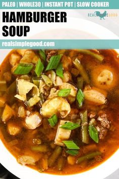 a close up of a bowl of food with meat and vegetable soup in the background