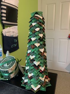 a christmas tree made out of strips of paper