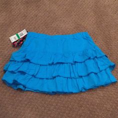 Girls’ Ruffled Skirt, Elastic Waistband, Aqua Blue, Size Large, New W/Tags. Adorable!! Cute Blue Ruffled Skirt, Cute Fitted Blue Skort, Cute Blue Cotton Skirt, School Skirt With Ruffles In Cotton, School Skirt With Cotton Ruffles, Cute Ruffled Skirt For School, Blue Cotton Tiered Skort, Blue Stretch Ruffle Skort, Blue Ruffled Stretch Skort