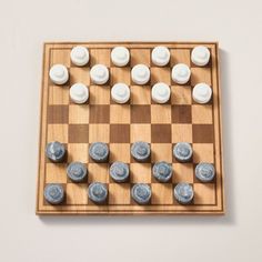 a chess board with white and blue pieces on it