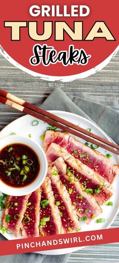 grilled tuna steaks on a white plate with chopsticks and red sauce