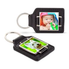 a black leather keychain with an image of a baby and a dog on it