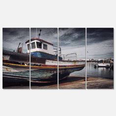 a boat sitting on top of a wooden dock