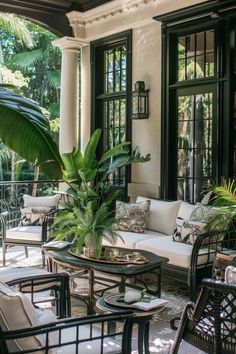 a living room filled with lots of furniture next to a lush green plant on top of a table