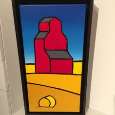 a painting on the wall of a room with a red barn and yellow ball in it