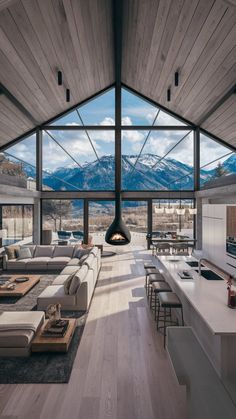 a living room filled with furniture and a fire place in the middle of a room