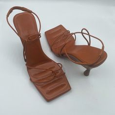 These Strappy Leather Sandals Feature A Modern Square Toe With A Wedge Heel. Perfect For The Summer. These Heels Are Preowned In Great Condition. Shows A Few Signs Of Wear. Review All Photos And Video Size 37 1/2 Heel To Toe Measurement Is Approx 10” Color:Caramel Heel: 4.25” Leather Upper Square Toe Slip-On Leather Sole Made In Italy No Box/No Dustbag Strappy Leather Sandals, Strappy Wedges, Modern Square, Womens Shoes Wedges, Wedge Heels, Leather Sandals, Dust Bag, Leather Upper, Wedges