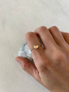 Natural rose cut 6mm crystal quartz takes a center stage in this delicate and minimal ring. Available in sterling silver, gold filled and solid 14k gold. The crystal is clear and faceted (rose cut). Solid gold sales are final. Thank you! * Featured ring-1mm gold filled, size 7 Minimalist Round Band Crystal Ring For Everyday, 14k Gold Filled Dainty Promise Ring, Dainty 14k Gold Filled Promise Ring, Gold Dainty Crystal Ring In Sterling Silver, Gold Sterling Silver Solitaire Crystal Ring, Dainty Gold Crystal Ring In Sterling Silver, Dainty 14k Gold Crystal Ring For Everyday, Delicate 14k Gold Filled Stackable Promise Rings, Minimalist Stackable 14k Gold Crystal Ring