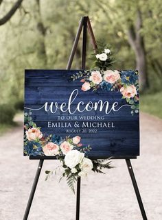 a welcome sign with flowers on it