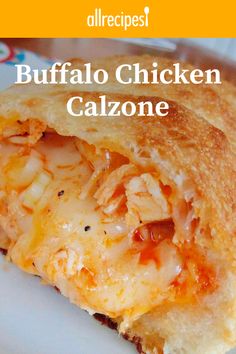 a close up of food on a plate with the words buffalo chicken calzonee