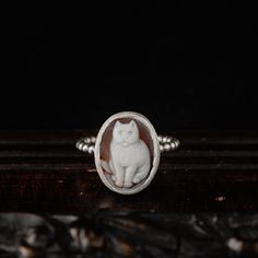 Chic and classy. Not only for cat lovers! This delicate, vintage inspired ring is an everyday wear piece.  A genuine (shell) cameo featuring a lovely cat is set in a simple .925 bezel and soldered on a beaded wire band. Made by hand in our jewellery studio in Greece. Each cameo is hand carved and each ring is made after purchase with respect to individuality and uniqueness. Please choose your favorite stone from the drop down menu during checkout. See last photo of the listing for details. -DETA Cat Rings, Jewellery Studio, Vintage Inspired Rings, Lovely Cat, Sterling Silver Cat, Cameo Jewelry, Cat Ring, Cameo Ring, Jewelry Studio