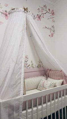 a baby crib with a white canopy over it