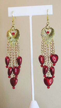 Red earring, an earring designed for a passionate date with someone special. This earring is made with heart shape beads, gold tone earring, gold tone connector and french hook. It measures 4" in length. PERFECT FOR: Everyday wear to the office Business meetings Dates Parties Events Church Gift for self Gift for girlfriend Gift for mom PLEASE NOTE – We ship our products within 2-3 days of purchase due to high demands and we double check each product before we ship. Once we ship , we will make av Gift For Self, Denim Bracelet, Pink Jewelry Set, Pink Hair Accessories, Self Gift, Denim Earrings, Church Gifts, Hat Brooch, Hair Accessories Collection