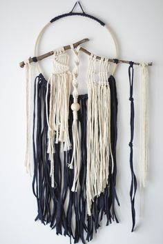 a wall hanging with several tassels attached to it