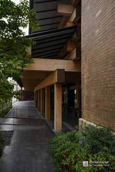 an outside view of a building with trees and bushes