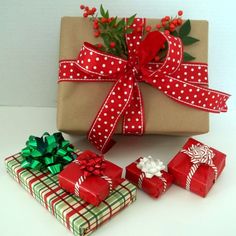 a present wrapped in brown paper with red and white polka dots tied around the bow