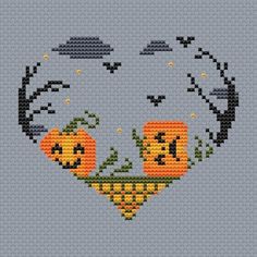 a cross stitch pattern with two pumpkins in the shape of a heart