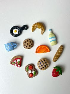 several different types of cookies and pastries on a white surface