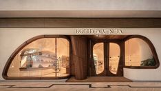 the entrance to boteca veneta is made out of wood and has arched windows