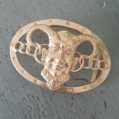 a metal object with a face on it