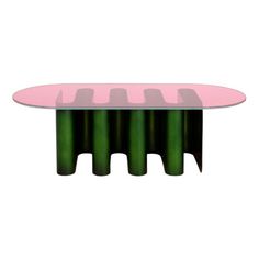 a pink and green table sitting on top of a white floor