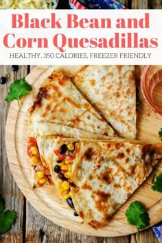 three quesadillas on a wooden plate with salsa