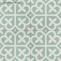 four tiles with white designs on them