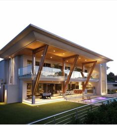 a large modern house with an outdoor pool