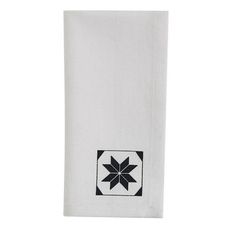 a white towel with a black and white flower on it