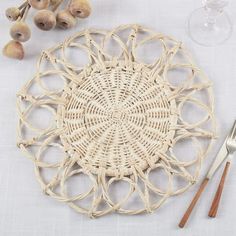 Fennco Styles Hand Twisted Rattan Floral Placemat 15" Round, 1- Piece Add instant boho elegance to your home with this Floral Rattan Placemat. Featuring a flower-inspired design, a subtle natural color finish, and an intricately woven pattern inject texture and warmth to any style. Chic and organic, this rattan placemat infuses an airy, rustic ambiance creating a transformative table design that echoes the beauty of nature. It's a great alternative to a charger plate and perfect for your dinner, Rattan Placemat, Rattan Placemats, Home Boho, Rattan Table, Flower Table, Charger Plate, Stylish Tables, Small Potted Plants, Table Placemats