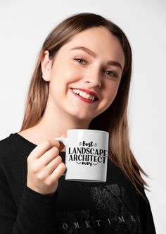 a woman holding up a coffee mug with the words your design here printed on it