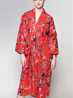 This luxurious long Red Kimono Robe features a gorgeous birds of paradise print on soft lightweight cotton. Handmade by artisans in Rajasthan, India, this truly exclusive red kimono robe features a front tie belt, long flowy sleeves and two large front pockets. Handcrafted with eco-friendly dyes, Fair trade and sustainably made, it's the perfect addition to your lounge-wear wardrobe. The lightweight woven 100% Cotton fabric also makes this a unique kimono bathrobe. This red kimono robe from Sevy Red Cotton Robe For Spring, Red Spring Robe For Loungewear, Red Spring Vacation Robe, Red Beach Robe For Spring, Red Robe With Kimono Sleeves For Spring, Red Cotton Kimono For Vacation, Red Summer Robe With Kimono Sleeves, Red Robe With Kimono Sleeves For Summer, Red Cotton Robe With Kimono Sleeves