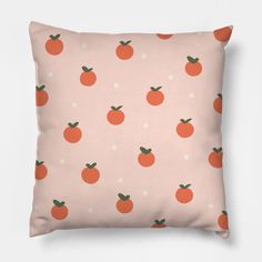 a pink pillow with oranges on it and polka dot dots in the background,