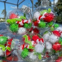 christmas ornaments are sitting on a glass plate