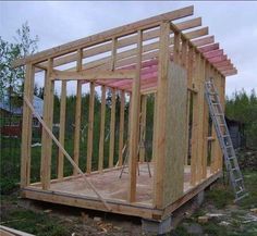 a house being built in the middle of a field